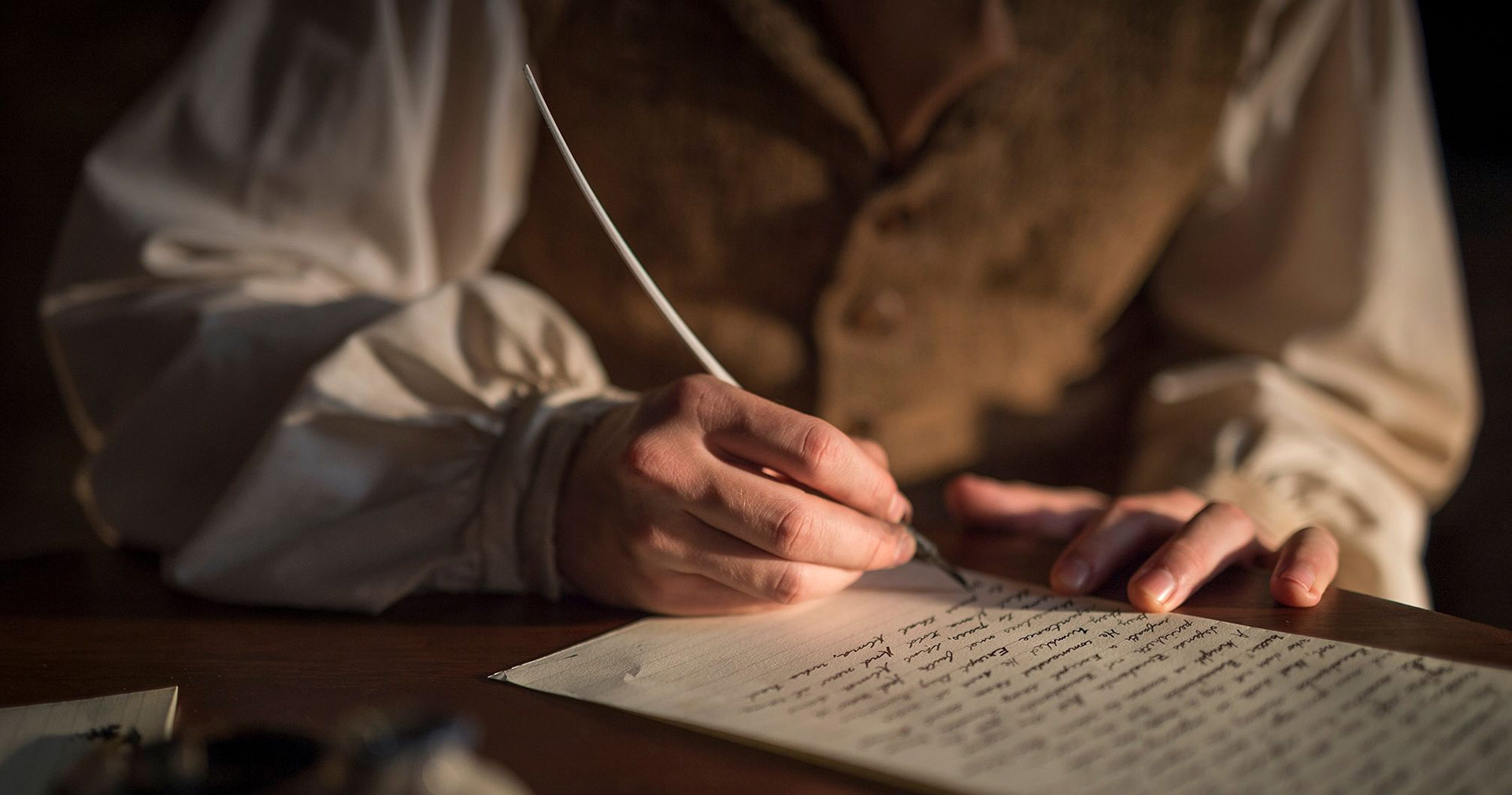 Oliver Cowdery scribing the text of the Book of Mormon. Image via Church of Jesus Christ.