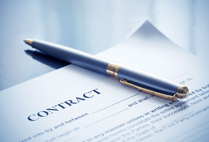 Image of contract via Adobe Stock. Photography by Maksym Dykha.