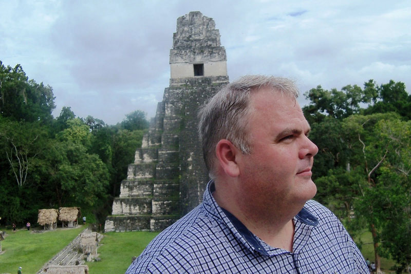 Mark Wright with Tikal Temple I in Background. Photo by Kirk Magleby.