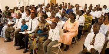 Photo of sacrament meeting via Gospel Media Library.
